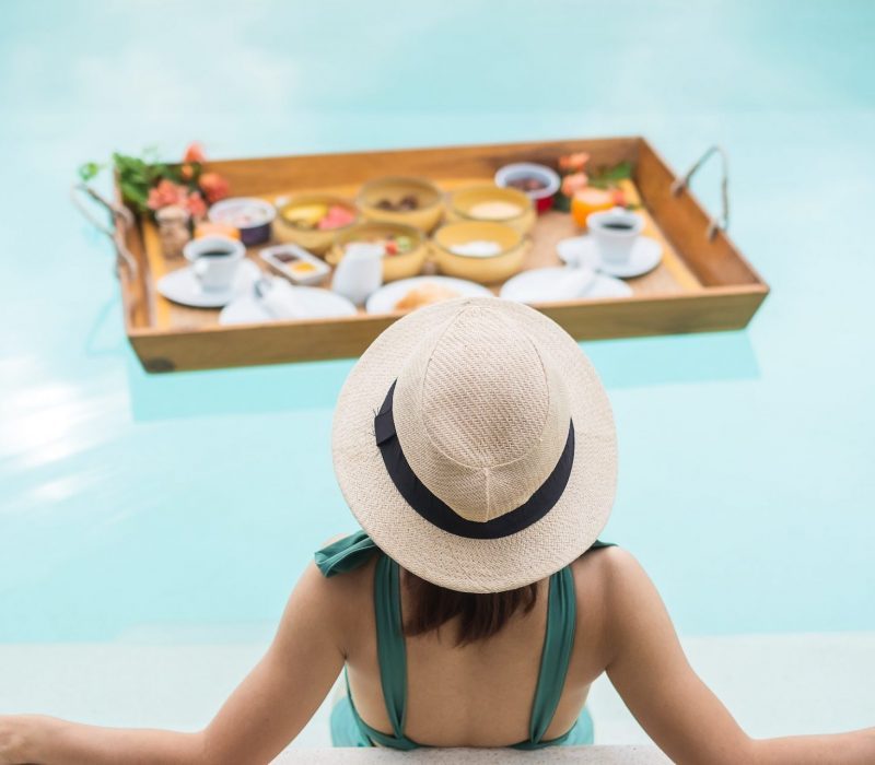 woman-having-floating-breakfast-in-luxury-pool-hotel-girl-with-hat-enjoy-in-tropical-resort-e1667343631510-px3cycskix5xo22id8fa4mwo8x2ojnqmai3d72yvrs